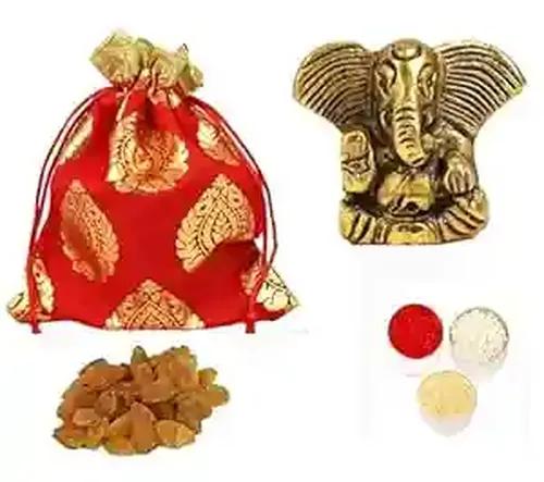 Bhai dooj gift set for brother/bhai dooj gift hamper/bhaiya dooj roli chawal set/bhai dooj gift/bhai dooj tika/bhaiya dooj gift for brother-potli of cashew+metal ganesha idol+roli chawal chandan